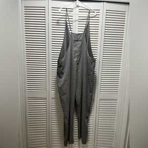 Oversized gray overalls. Never worn. Soft and light material.